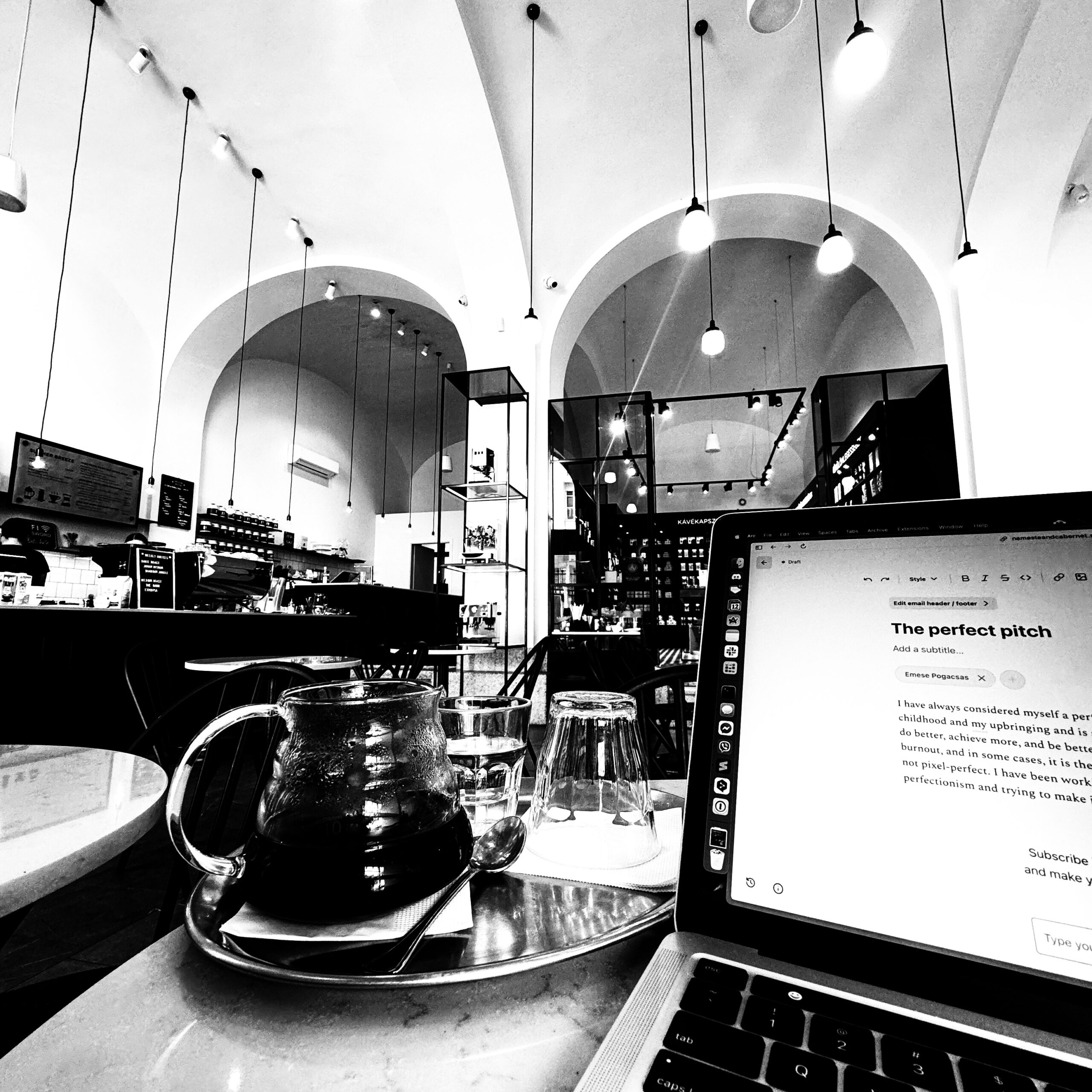 Coffee and an open notebook on a table